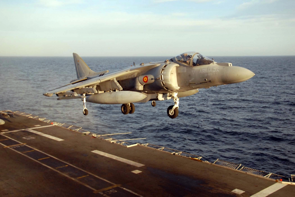 A fighter jet taking off from a ship Description automatically generated with low confidence